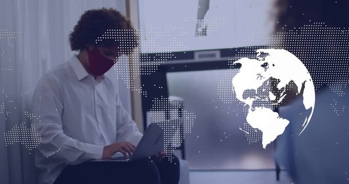 Vertical video: Typing man red mask on laptop in lobby for work as globe appearing, copy space