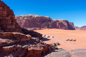 Fototapeta premium Wadi Rum known also as the Valley of the Moon or Red mountains. Valley cut into the sandstone and granite rock in southern Jordan, near the border with Saudi Arabia.