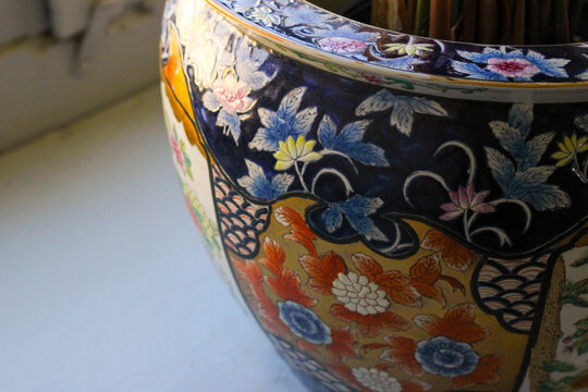 Vintage handmade blue floral vase close up