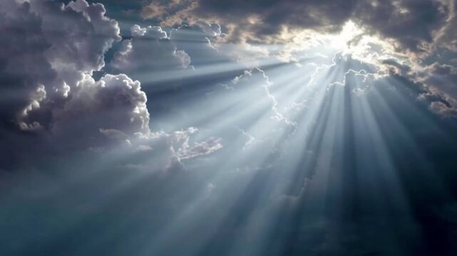 A serene video of sunbeams shining through clouds in a blue sky