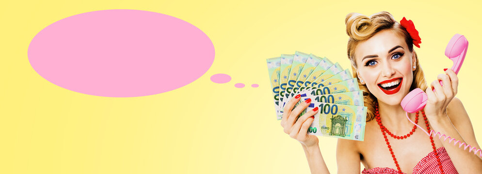 Expressive happy smile pin-up blond woman girl shows points money euro cash banknotes fan, holds phone. Isolated yellow background. Pink think speech bubble speechbubble, cloud ballon, thought float