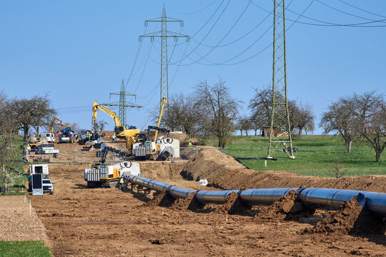 Large pipeline construction site in Ludwigsburg district, Baden-W&uuml;rttemberg, Germany. Workers and machinery install underground pipes for future gas and hydrogen energy supply across agricultural land