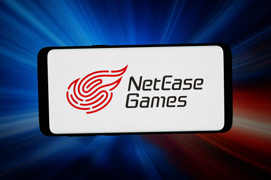 Stuttgart, Germany - 03-19-2026: In this photo illustration, the logo of Chinese video games company NetEase Inc. is displayed on a smartphone in front of abstract background on computer screen.