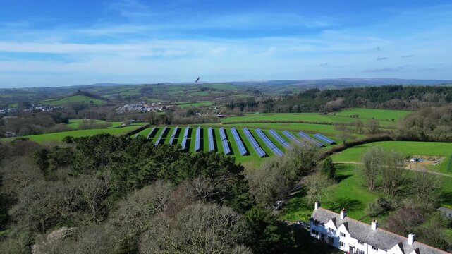 Dartington, South Devon, England: DRONE VIEWS: A solar panel farm in open countryside near Dartington Hall. Solar energy forms part of the UK government plan for net zero carbon emissions by 2030.