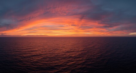 Obraz premium Panoramic bird eye scene showing vibrant sunset hues above peaceful seas