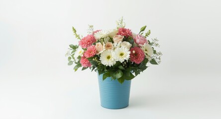 Fototapeta premium Elegant bouquet of flowers held in a blue bucket on white backdrop with greeting card