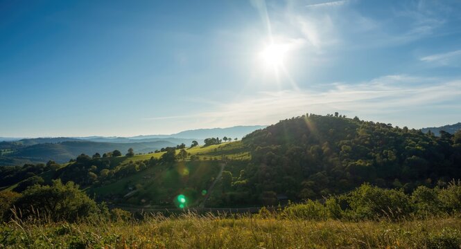 Outdoor summer hillscape illuminated by a sunny day and clear skies