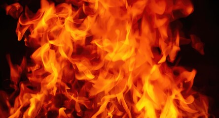 Fototapeta premium Intense close up fire flames exhibiting bright red and yellow color palette