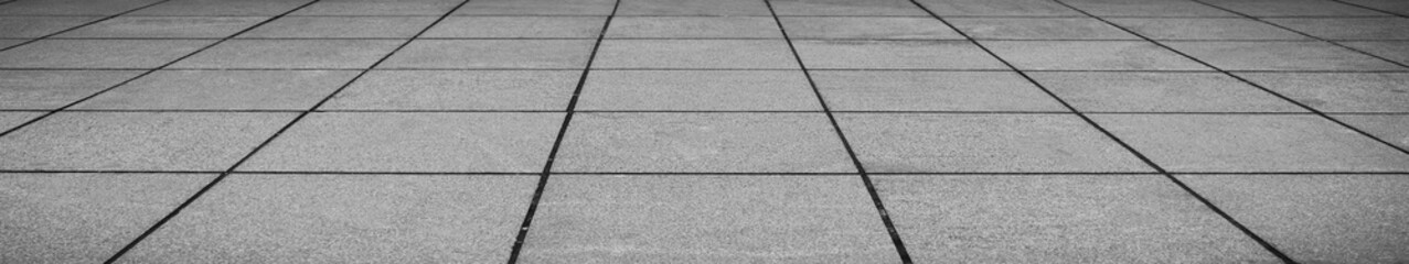 Fototapeta premium empty stone floor top in perspective. grey tile floor background in perspective view. line. empty copy space stone street. pavement. Granite outdoor tiled floor. gray granite. Marble texture
