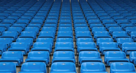 Fototapeta premium Neatly aligned blue seating in rows showcasing an empty grandstand setting