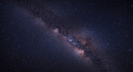 Obraz premium Panorama of star filled Milky Way with grainy texture on deep night universe