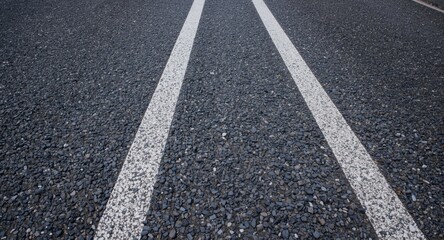 Fototapeta premium High resolution image of highway asphalt with contrasting white line details