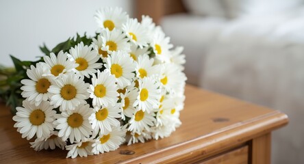 Obraz premium Cheerful daisies bouquet displayed on wooden bedroom table with ample text space