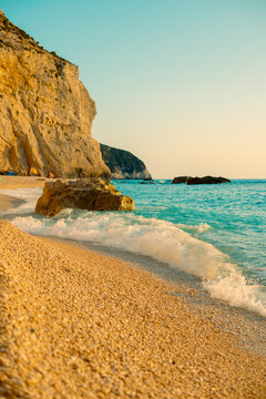 ​Lefkada Greece beach sunset with turquoise water and golden cliffs