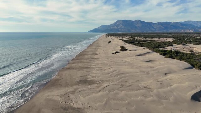 A drone view of the beautiful Patara beach and sand dunes on a sunny day. Fethiye. Turkey.