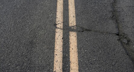 Fototapeta premium Close up view of asphalt road with tire marks and lane markings