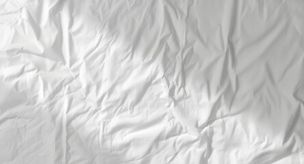 Fototapeta premium Crumpled white table cloth surface with gentle highlight