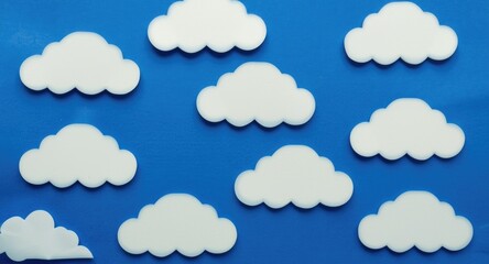Fototapeta premium Set of lively cloud shape paper notes over a deep blue surface for note taking