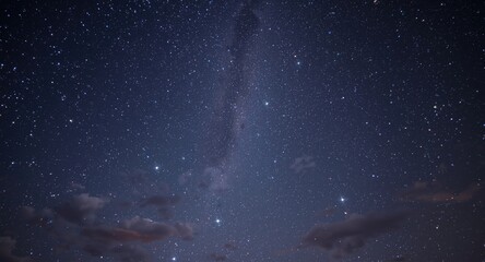 Fototapeta premium captivating space background showcasing twinkling stars and whimsical clouds