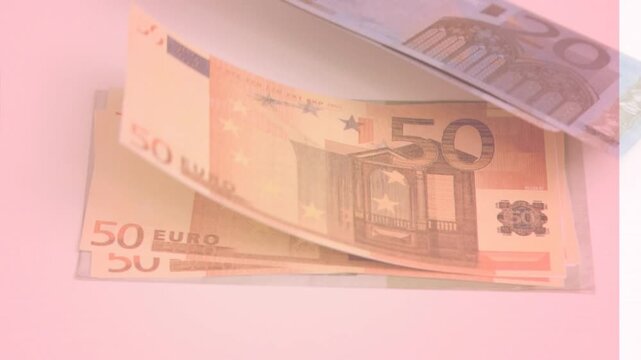 Animation of close up of euro bills flying against pink background