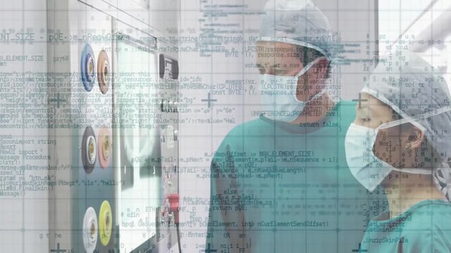 Doctor pressing touchscreen controls and guiding nurse adjusting scans for medical imaging quality