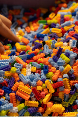 Multi-colored small LEGO construction pieces. © Juli