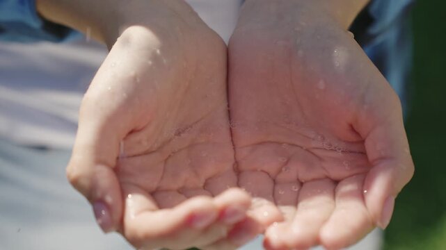 keep clean clear water in the palms of your hands, eco, freshen up on a hot summer day, keep your hands clean and healthy, the environment, droplets and splashes of wet water splashes.