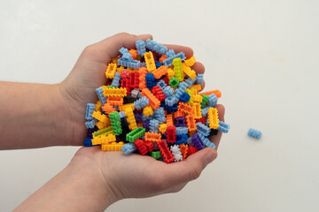 Obraz premium Multi-colored small LEGO construction pieces.