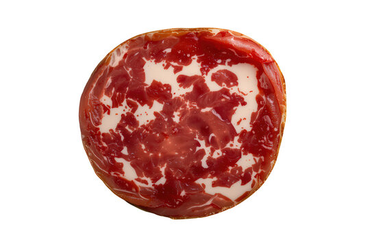 Round slice of italian coppa or capicola isolated, offering a delicious appetizer or charcuterie board ingredient