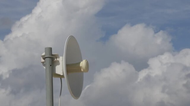 satellite dish against blue sky