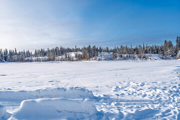 Winter landscape with frozen lake near Yellowknife, Northwest Territories, Canada © beataaldridge