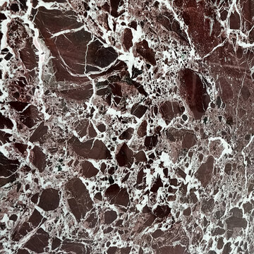 The texture of the burgundy-coloured quartz sinter with white stripes.