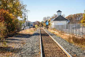 Small railway station with a single track in a seaside town on a clear autumn day