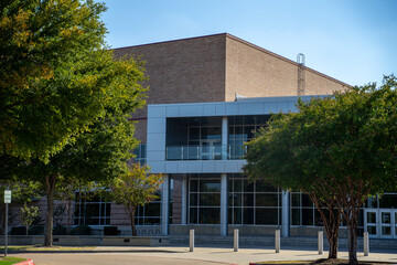 Brick and Glass Building With Trees and Sidewalk in Allen, Texas © Lone Star Stock