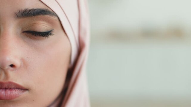 Close up serious Muslim woman in hijab at home indoors looking at camera half face portrait Arabian female business Islamic girl headscarf skincare makeup ethnic beauty businesswoman indoor apartment