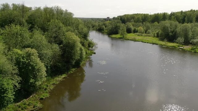 Forward ascending drone flight over river