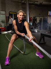 Fitness and health concept. A fit young woman works out in a modern gym. Athletic woman doing exercise. © Lukas Gojda