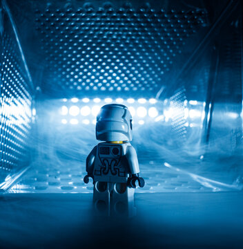 Gothenburg, Sweden - October 04 2017: Miniature astronaut exploring futuristic illuminated tunnel with fog.