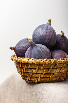 Fresh figs in a straw basket.