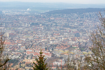Fototapeta premium Detailed elevated view of Zurich city showing dense urban area with buildings and hills in Switzerland