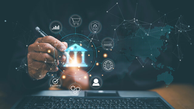 Digital banking and fintech concept. Human using pen pointing virtual bank icon and connected financial services interface. Online payment, security, global transactions and smart finance technology.