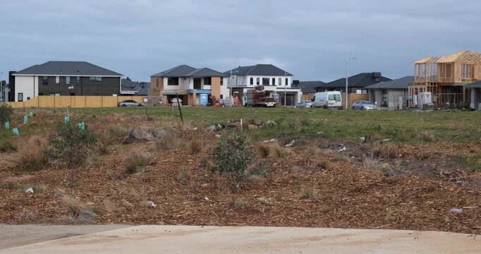 Residential housing development in Tarneit, outer suburb of Melbourne, Australia, with newly built homes, construction in progress, and undeveloped land. Suburban housing growth, urban expansion