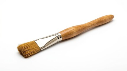 Fototapeta premium A flat artist's paintbrush with a wooden handle is isolated on a clean white background, showcasing its bristles and readiness for creative work.