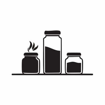Three jars of different sizes on a shelf, black and white.