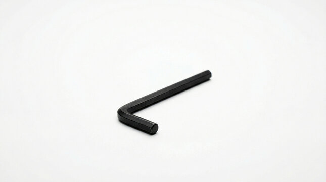 Black hex key or Allen wrench isolated on white background, L-shaped tool, assembly equipment, maintenance hardware.