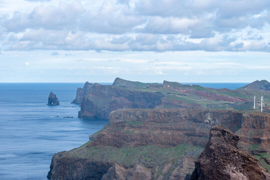 Viewpoint Calhau da Furna do Bode on Madeira, green hills meet sea, discovery archipelago landscape, volcanic island travel, adventure vacation, colorful rooftops, Madeira, Portugal