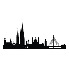 Fototapeta premium Silhouette of a city skyline featuring a cathedral and modern bridge