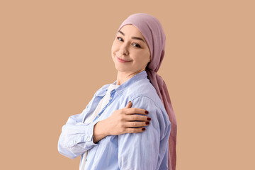 Fototapeta premium Young woman after chemotherapy on beige background. Brain cancer concept
