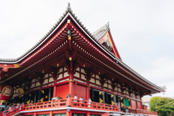 Fototapeta premium Senso-Ji temple in Asakusa district, Taito City, Tokyo, Japan, Asakusa Kannon, Kinryu-zan Buddhist temple shrine in autumn fall day, with Nakamise shopping street, Kaminarimon Gate and Hozomon