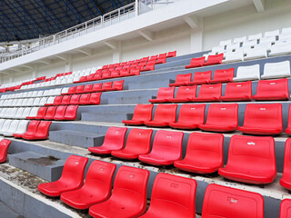 Fototapeta premium Red and white football stadium benches